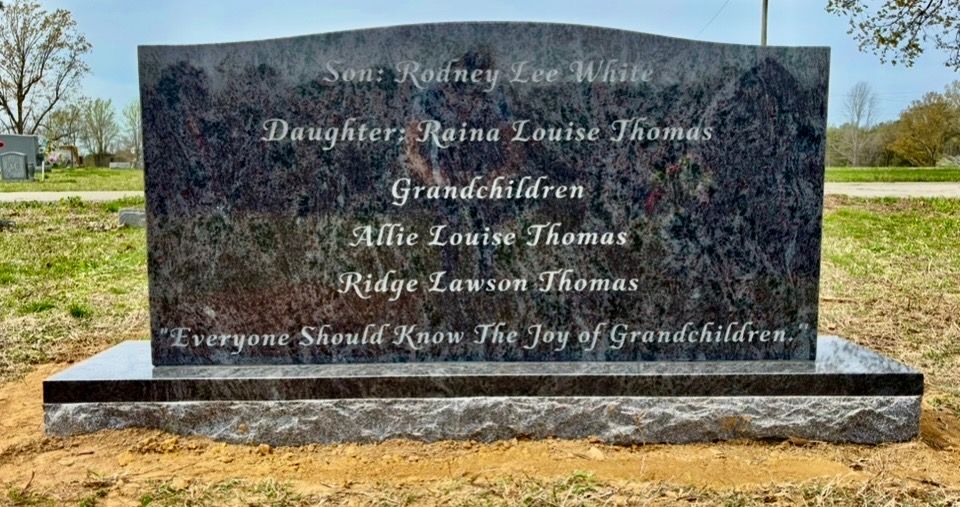 upright monument with family tree engraving